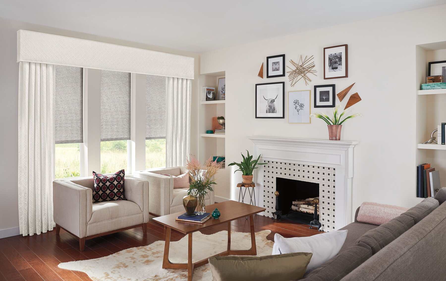 Living room with gray and white chairs and white long curtains