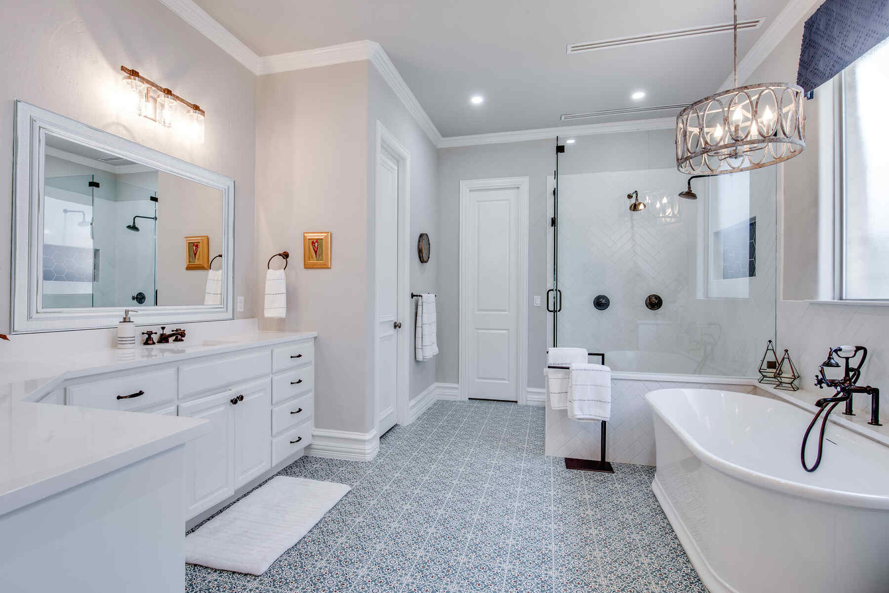 Bathroom with white furnishing and low hanging light fixture