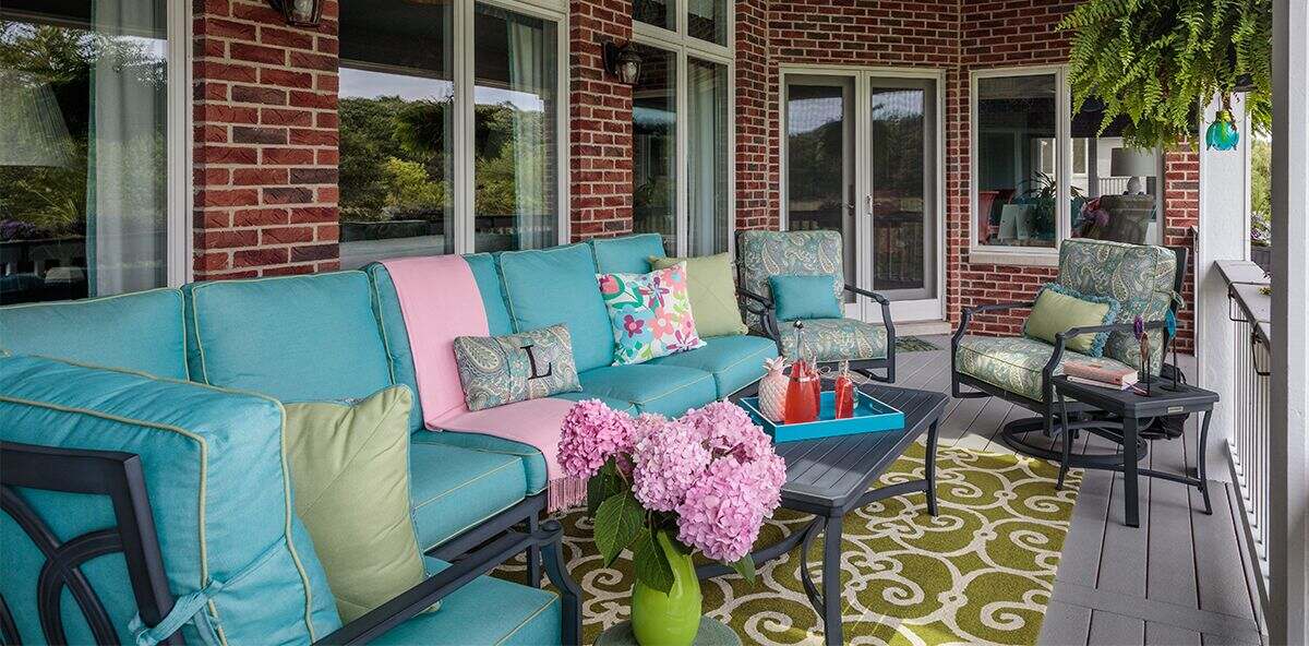 Outdoor deck with a sofa set with printed and colorful fabrics