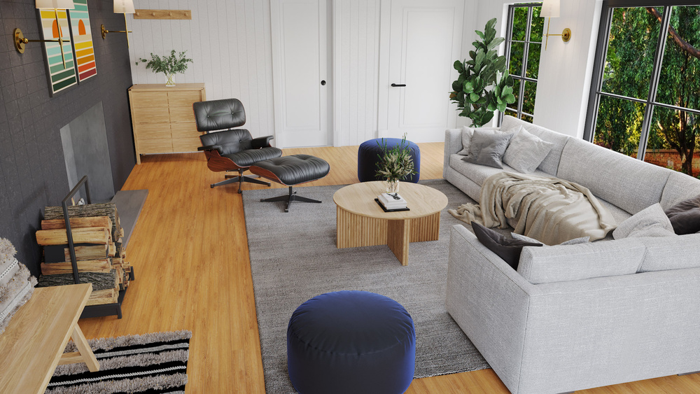 Living room area with a vintage desk chair, gray sectional sofa and a circular coffee table
