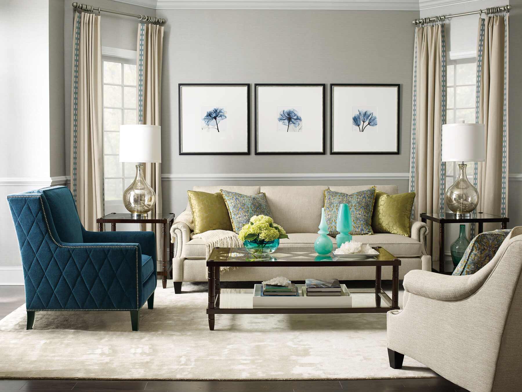 A stylish living room featuring blue and green furniture, adding a pop of color to the space